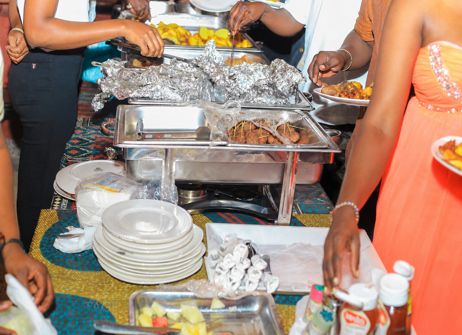 Staff serving guests at Heritage Hotels Arua